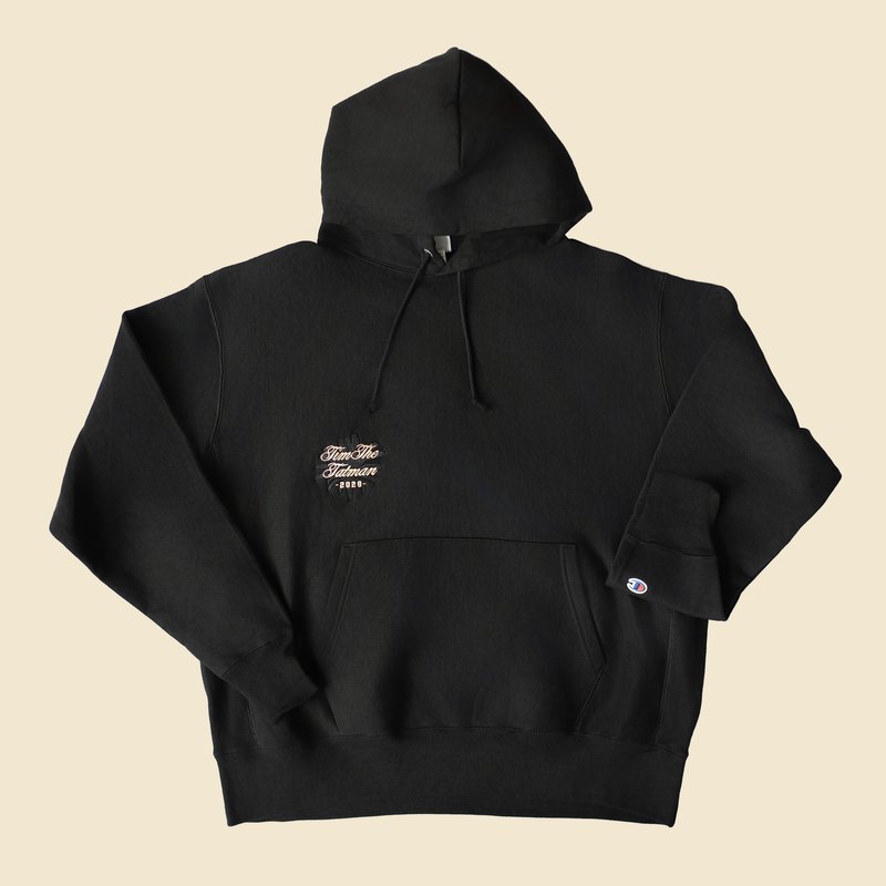Black Champion hoodie with embroidered TimTheTatman 2026 script chest logo