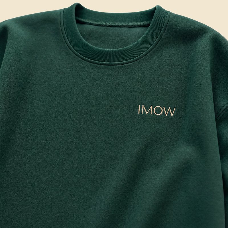 Green crewneck with IMOW embroidered on the chest